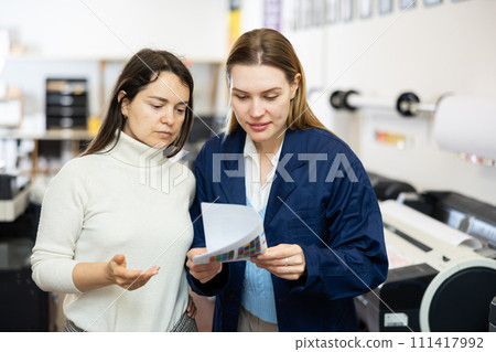 Women publishing facility workers having conversation about work 111417992