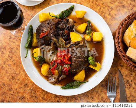 Fried pork in red wine with potatoes and stewed vegetables Fried pork in red wine with potatoes and stewed vegetables 111418251