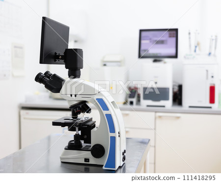 Digital trinocular microscope standing on table in veterinary clinic laboratory 111418295