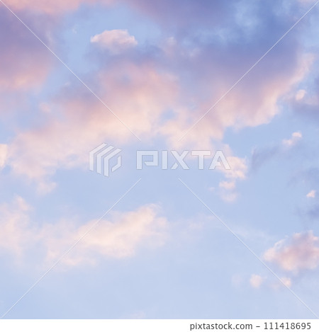 Background of blue sky with pale pink clouds at sunset 111418695