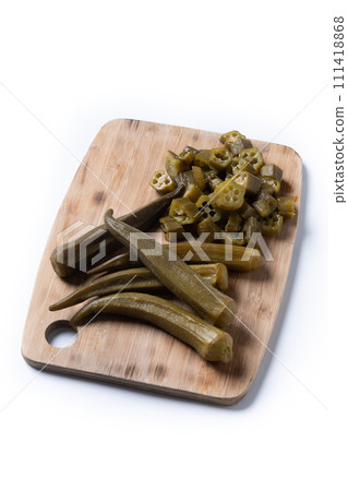 Natural Okra slices on cutting board isolated on white background 111418868