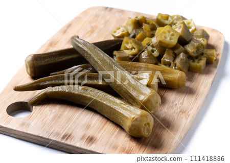 Natural Okra slices on cutting board isolated on white background 111418886