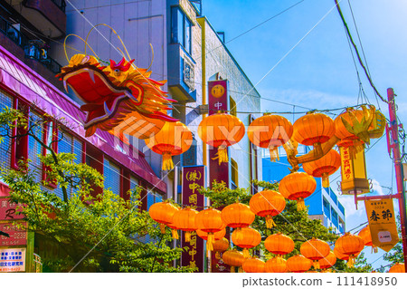 Yokohama cityscape in Japan 2024 Yokohama Chinatown with Chinese New Year lights. Dragon lanterns on the Ximen Street side of Chinatown = February 8, 2020 111418950