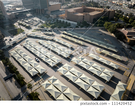A dozens Umbrellas in a Tranquil Riyadh Parking Lot 111420452