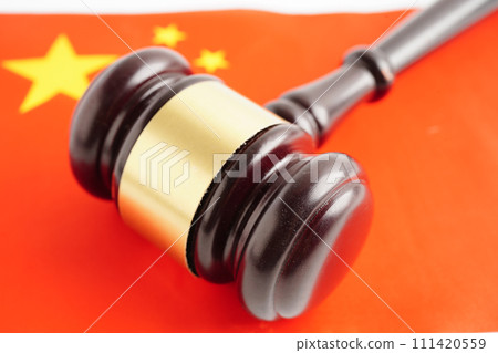 China law, Legal, justice and agreement, wooden court gavel on flag. 111420559