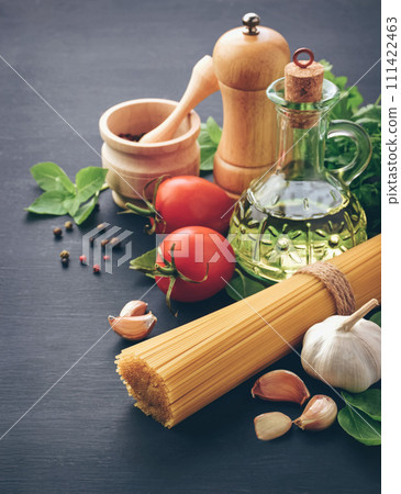 Spaghetti alla puttanesca - italian pasta ,with tomatoes, black olives, capers, anchovies and basil. 111422463
