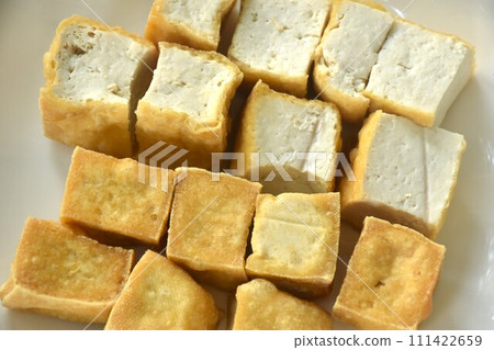 deep fried tofu dipping with sweet crushed bean sauce on plate 111422659