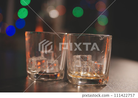 Celebration night, pour whiskey into a glass. Give to friends who come to celebrate Celebration night, pour whiskey into a glass. Give to friends who come to celebrate 111422757