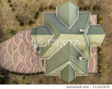 Aerial top view of new residential house cottage with shingle roof on fenced big yard on sunny day. 111422879