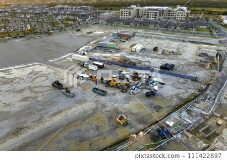Prepared for building works construction site with many equipment in american rural area. Development of residential housing in US suburbs Prepared for building works construction site with many equipment in american rural area. Development of residential housing in US suburbs 111422897
