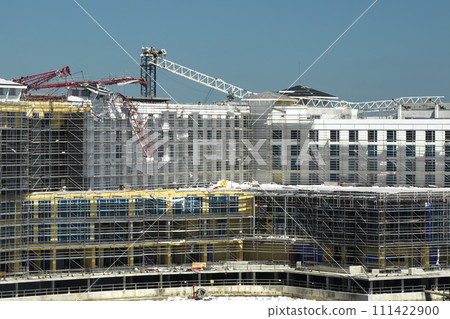 Aerial view of ruined by hurricane Ian construction crane on high apartment building site in Port Charlotte, USA Aerial view of ruined by hurricane Ian construction crane on high apartment building site in Port Charlotte, USA 111422900