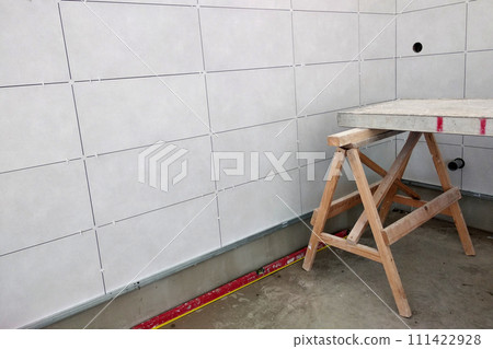 Wall ceramic tiles installation on mortar glue. 111422928