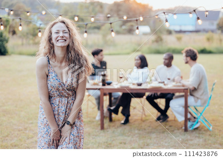 Joyful Woman at Outdoor Garden Party 111423876
