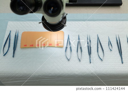 Stainless Steel Surgical Instruments on Draped Table 111424144