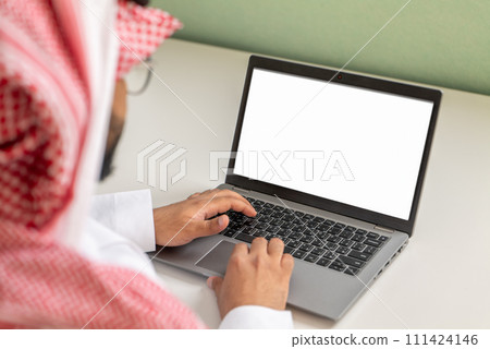 Hands typing on a laptop 111424146