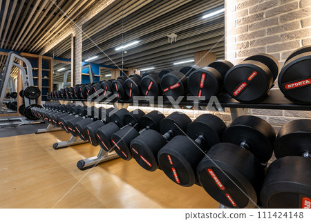Weight Room with Racks of Dumbbells 111424148