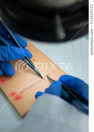 Stainless Steel Surgical Instruments on Draped Table 111424151