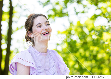 Joyful Young Woman in Summer Park Joyful Young Woman in Summer Park 111424253