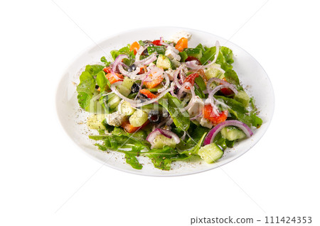 Traditional greek salad with fresh ingredients, feta cheese, olives, red tomatoes, cucumbers and greens Traditional greek salad with fresh ingredients, feta cheese, olives, red tomatoes, cucumbers and greens 111424353