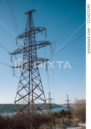 High voltage substation.World electricity crisis.Steel power transmission pylons 111425240