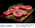 Fresh raw meat steaks on cutting board on dark background 111425377