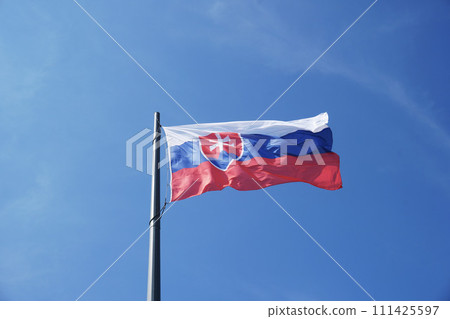 The flag of Slovakia hangs on the mast, the colors are white, red and blue The flag of Slovakia hangs on the mast, the colors are white, red and blue 111425597
