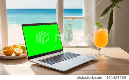 Laptop with green screen on a table by the beach with a tropical cocktail, palm trees, and ocean view portraying a relaxed work environment Laptop with green screen on a table by the beach with a tropical cocktail, palm trees, and ocean view portraying a relaxed work environment 111425989