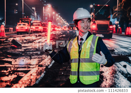 Security guard controlling traffic on the road Security guard controlling traffic on the road 111426833