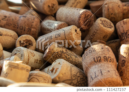 Lots of wine corks. Vineyard, winery, restaurant, hotel, winery, wine collection. Background. The texture. Lots of wine corks. Vineyard, winery, restaurant, hotel, winery, wine collection. Background. The texture. 111427237
