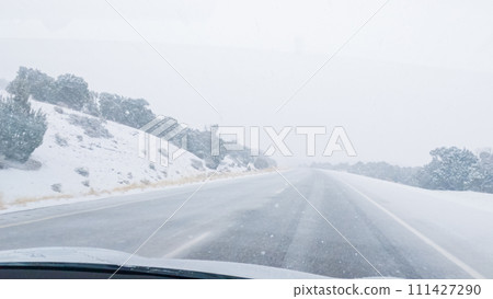 POV-Electric vehicle is captured deftly navigating the I-70 highway during a winter storm in Western Colorado. POV-Electric vehicle is captured deftly navigating the I-70 highway during a winter storm in Western Colorado. 111427290