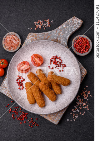 Delicious crispy cheese sticks with mozzarella, salt and spices 111427691