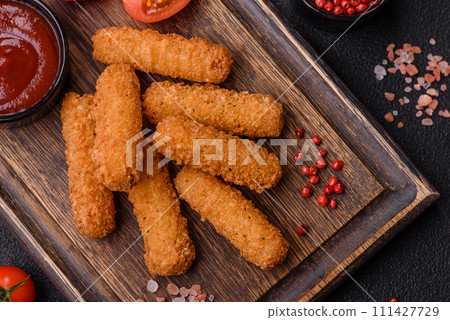 Delicious nuggets, rings and balls of mozzarella and parmesan cheese with salt and spices 111427729