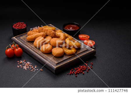 Delicious nuggets, rings and balls of mozzarella and parmesan cheese with salt and spices 111427746