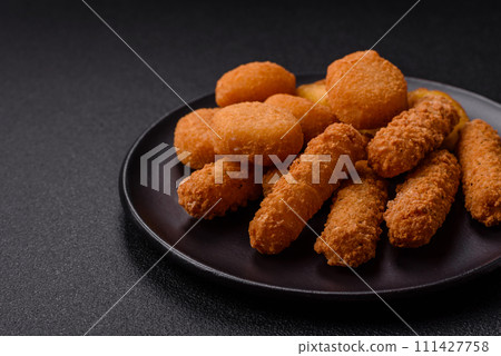 Delicious nuggets, rings and balls of mozzarella and parmesan cheese with salt and spices 111427758