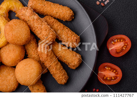 Delicious nuggets, rings and balls of mozzarella and parmesan cheese with salt and spices 111427767