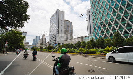 Jakarta's roads and streets with cars during the daytime. 111429399