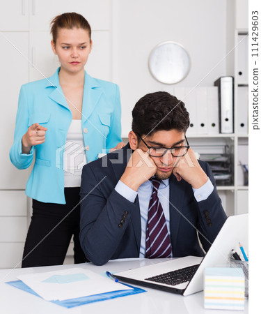Upset man with disgruntled boss 111429603