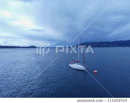 Aerial view of yacht sailing near beautiful Islands. Beautiful clouds mountains 111429724