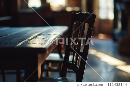 empty chair at a table, symbolizing the loss and absence felt by those who have lost loved ones to overdose. Concept of overdose 111432144