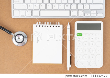 Workspace desk with open blank notebook and canculator for creative flat lay concept 111432577