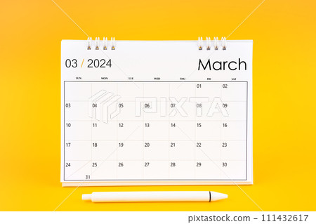 March 2024, Monthly desk calendar for 2024 year and pen on yellow background. 111432617
