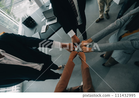 Group of college touch hands for unity group to success business. Group of college touch hands for unity group to success business. 111432995