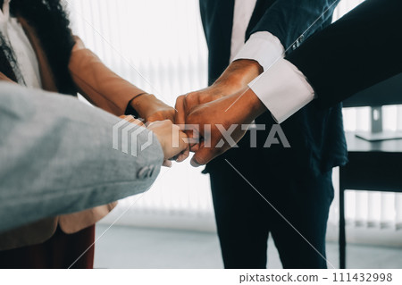 Group of college touch hands for unity group to success business. 111432998