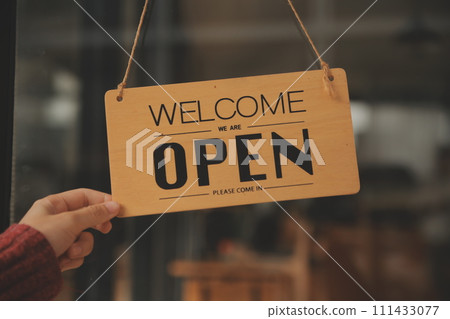 Startup successful small business owner sme beauty girl stand with tablet smartphone in coffee shop restaurant. Portrait of asian tan woman barista cafe owner. SME entrepreneur seller business concept 111433077