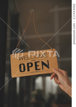 Startup successful small business owner sme beauty girl stand with tablet smartphone in coffee shop restaurant. Portrait of asian tan woman barista cafe owner. SME entrepreneur seller business concept 111433082