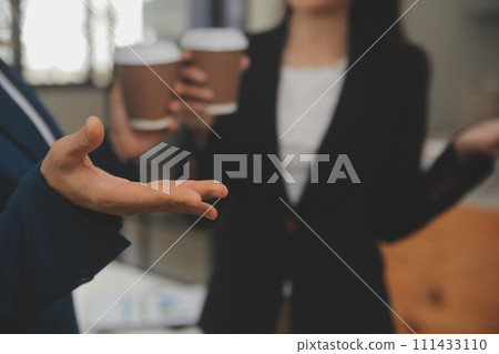 Entrepreneur Asian businessman and businesswoman discussing new business project in tablet in modern Meeting In Modern Office, Asian business casual concept. Entrepreneur Asian businessman and businesswoman discussing new business project in tablet in modern Meeting In Modern Office, Asian business casual concept. 111433110