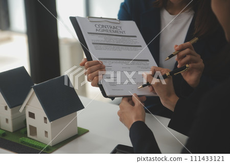 Business Signing a Contract Buy - sell house, insurance agent analyzing about home investment loan Real Estate concept. Business Signing a Contract Buy - sell house, insurance agent analyzing about home investment loan Real Estate concept. 111433121