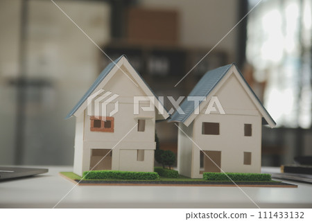 Business Signing a Contract Buy - sell house, insurance agent analyzing about home investment loan Real Estate concept. Business Signing a Contract Buy - sell house, insurance agent analyzing about home investment loan Real Estate concept. 111433132