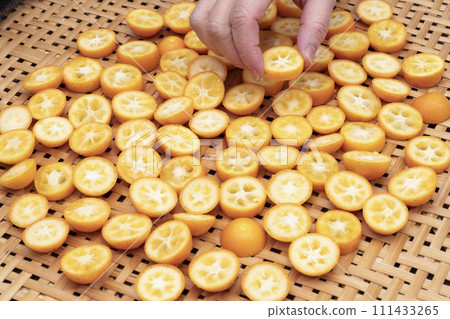 Kumquats sun-dried and arranged to make dried fruits Kumquats sun-dried and arranged to make dried fruits 111433265
