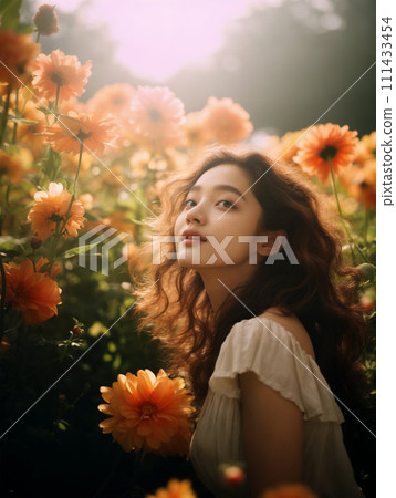 A woman standing in a flower field looking up at the sky A woman standing in a flower field looking up at the sky 111433454